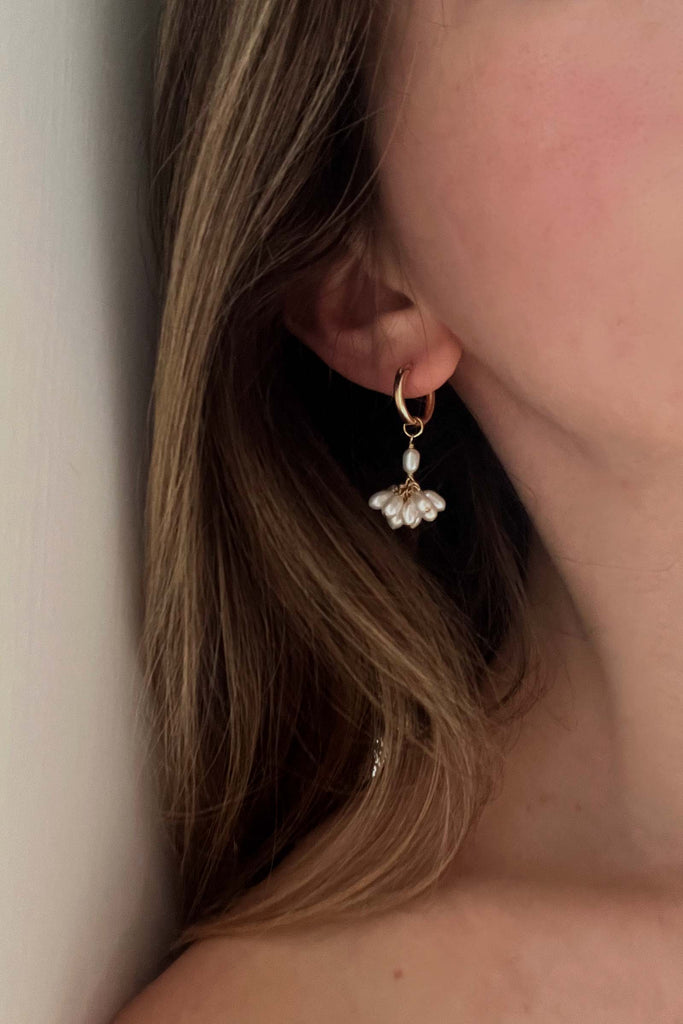 Huggie hoop earrings with pearls